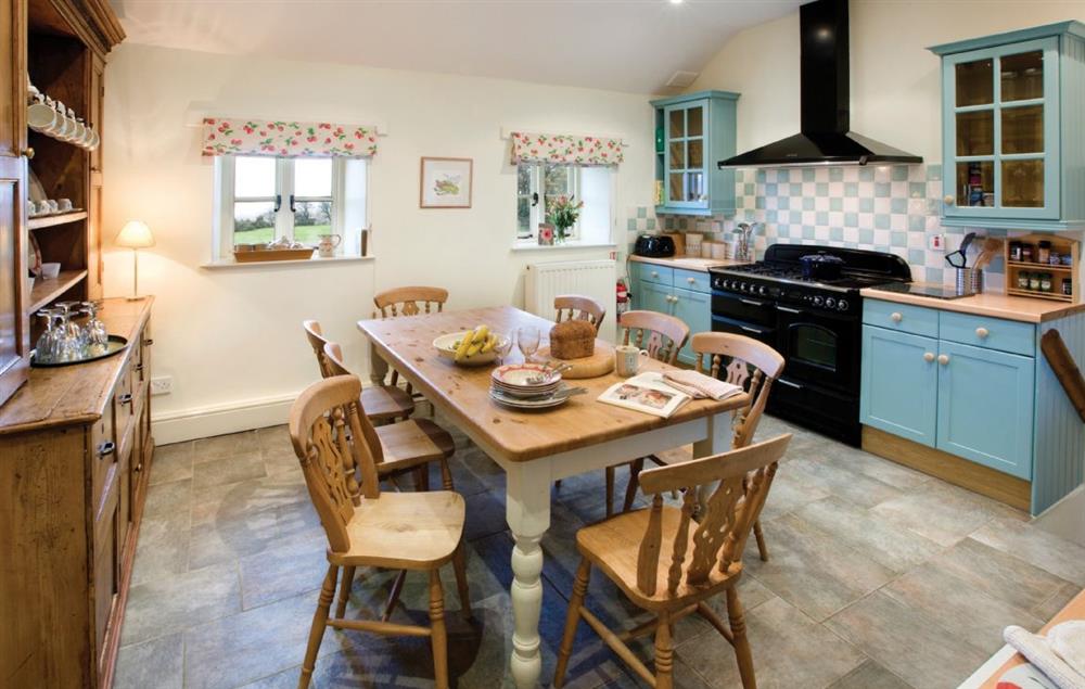 four steps from hallway to kitchen with breakfast table at Ty Newydd, Bodnant Estate