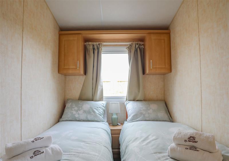 A bedroom in Ty Newydd Caravan at Ty Newydd Caravan, Llannor near Pwllheli