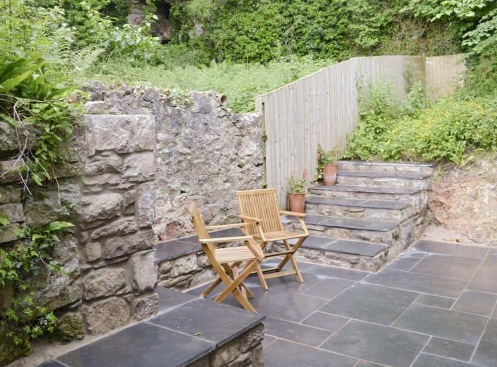 Paved patio area with outdoor furniture at Ty Newydd y Graig in Tremeirchion, near St. Asaph, Denbighshire