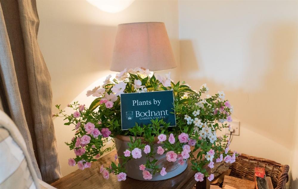 Fresh flowers provided by Bodnant Garden Centre await your arrival at Ty Uchar Ffordd, Bodnant Estate