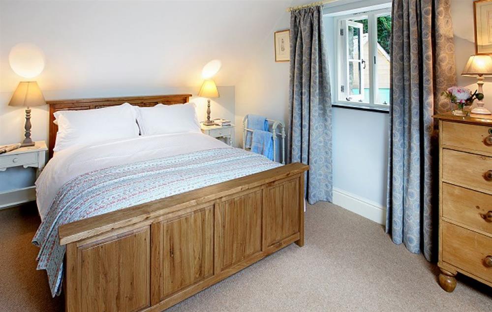 Master double bedroom with 5’ king size bed at Tyddyn Derwen, Bodnant Estate