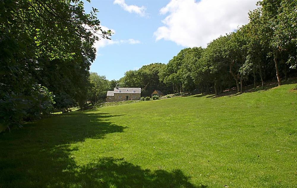 Tyddyn Derwen, nestled in woodland and overlooking a field (photo 2) at Tyddyn Derwen, Bodnant Estate