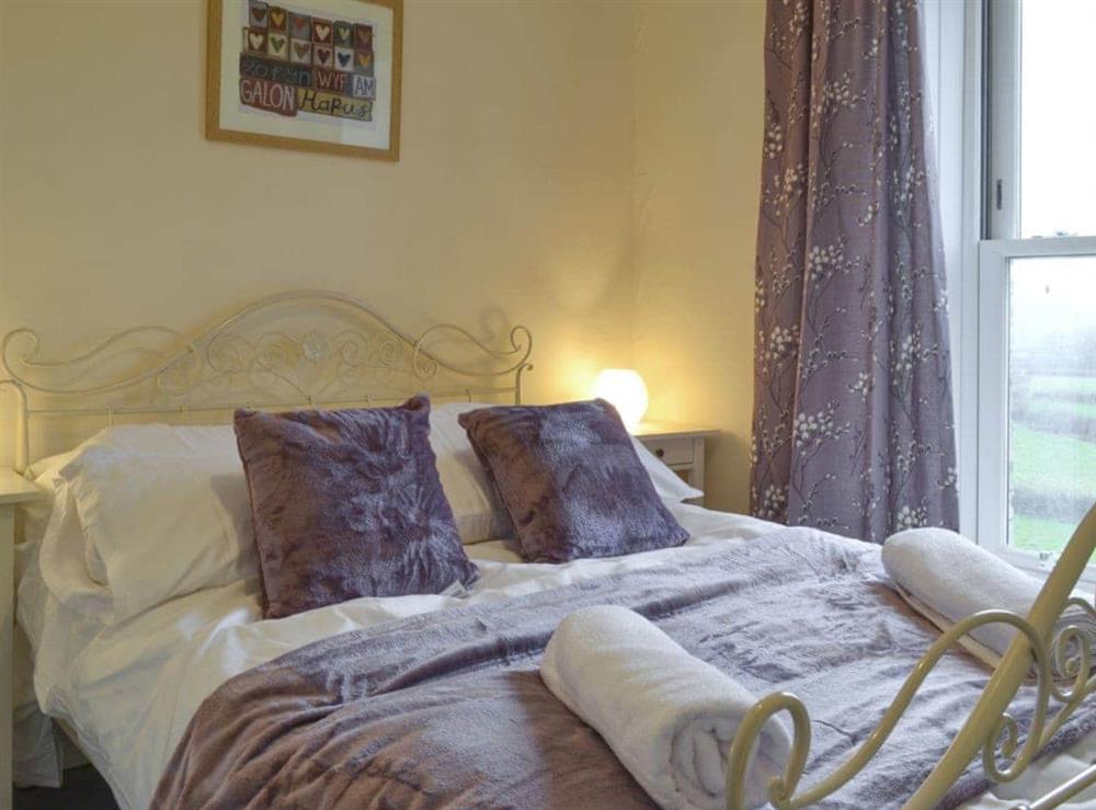 Restful double bedroom at Tyllwyd Farmhouse in Capel Bangor, near Aberystwyth, Dyfed