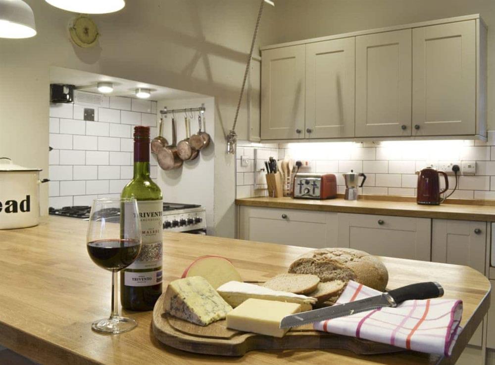 Well-equipped fitted kitchen at Tyllwyd Farmhouse in Capel Bangor, near Aberystwyth, Dyfed