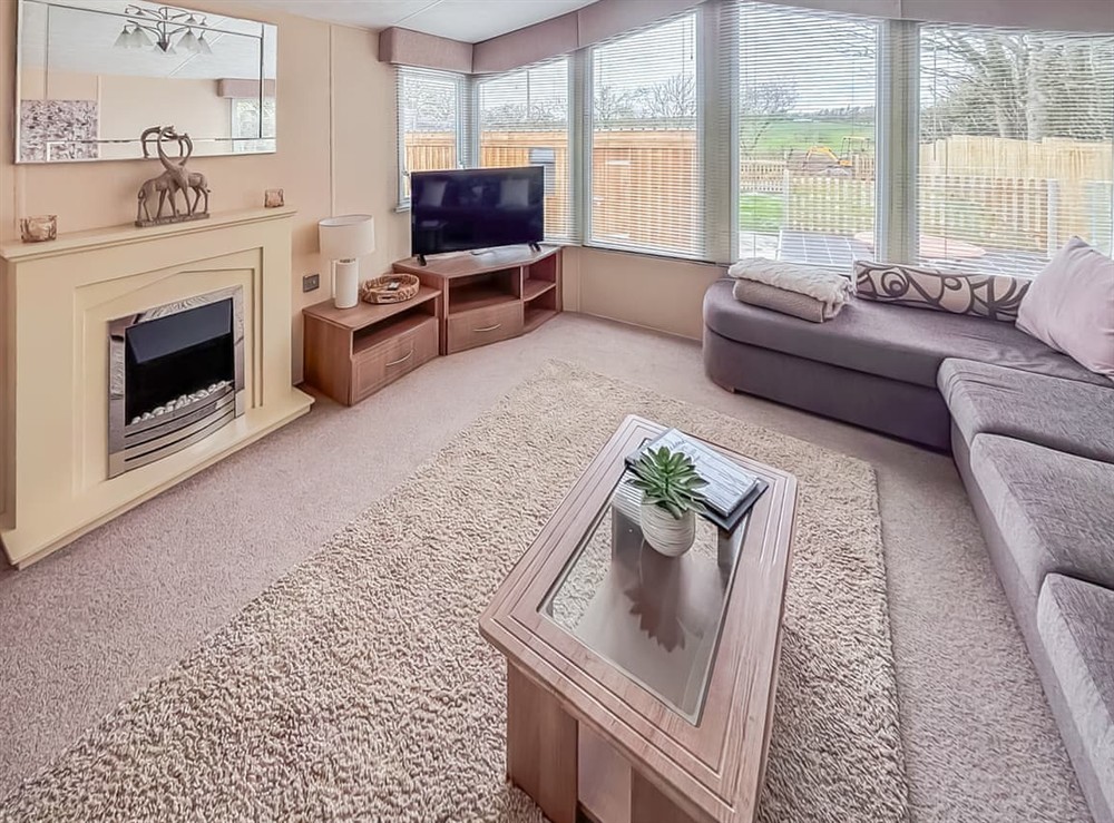 Open plan living space at Tyn Llidiart Static in Llanfairpwllgwyngyll, Gwynedd