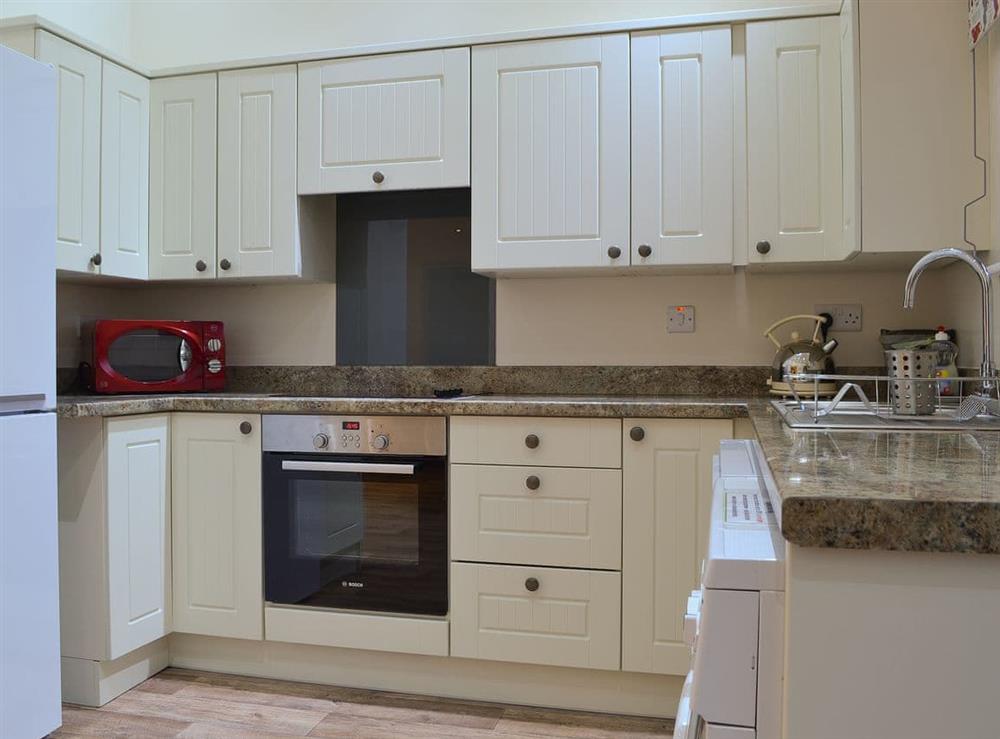 Well-fitted and well-equipped kitchen area at Beudy Canol, 