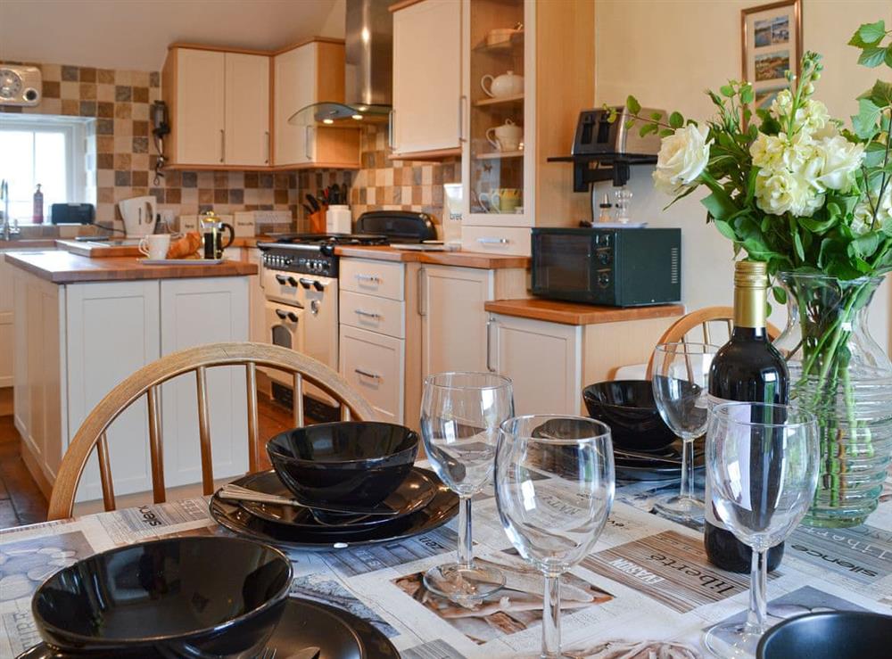 Kitchen with dining area at Tyn Lon in Moelfre, near Bangor, Anglesey, Gwynedd