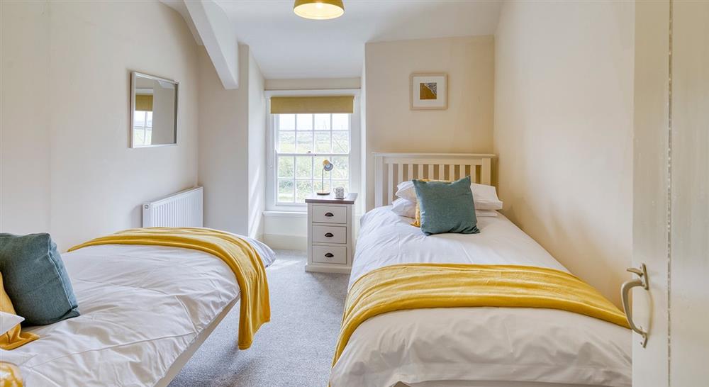 The first twin bedroom at Ty'n Y Parc Farmhouse in Gwynedd, 