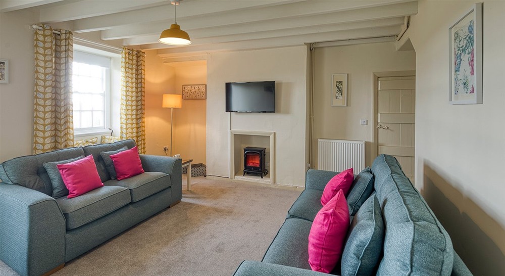 The sitting room (photo 2) at Ty'n Y Parc Farmhouse in Gwynedd, 
