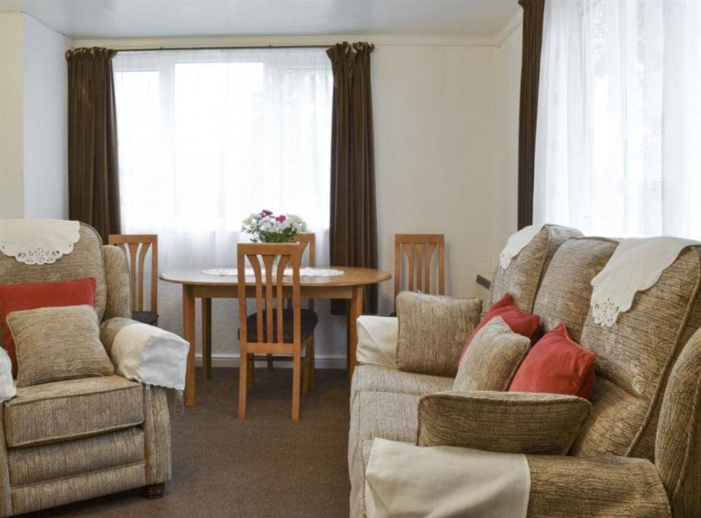 Homely living and dining room at Tynlone Villa in Swyddffynnon, near Devils Bridge, Dyfed