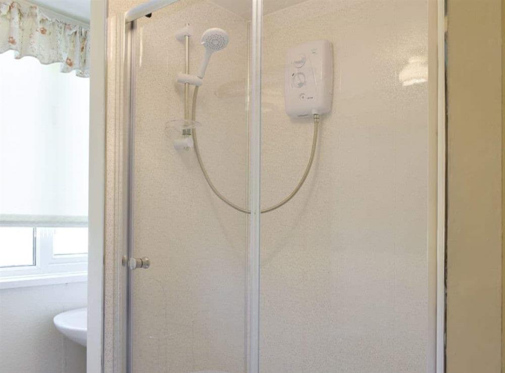 Shower cubicle within family bathroom at Tynlone Villa in Swyddffynnon, near Devils Bridge, Dyfed