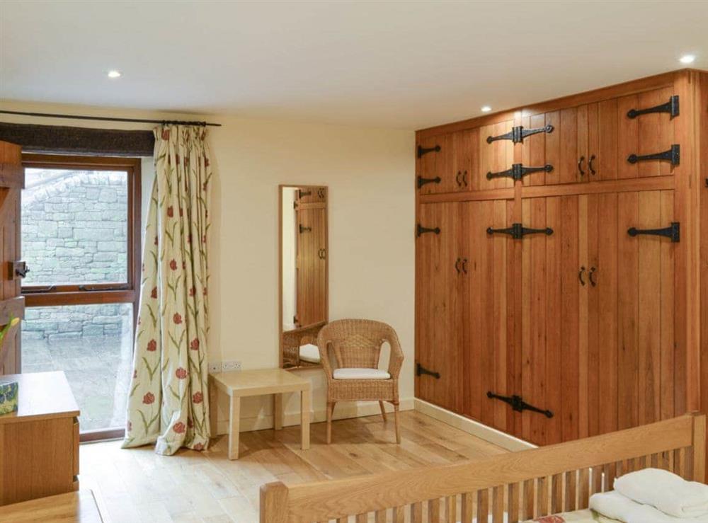Built-in storage within the double bedroom at Tythe Barn in Grindleford, Derbyshire., South Yorkshire