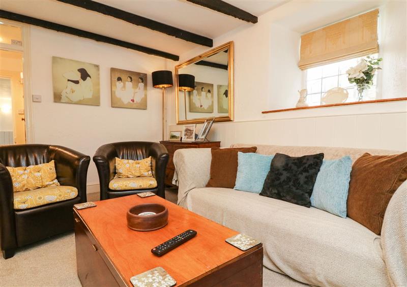Relax in the living area at Tythe Barn House, Combe Martin