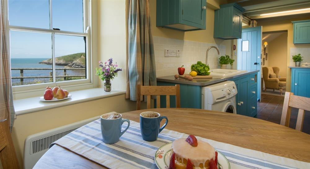 Kitchen and dining area at Tywyn Cottage in Cemaes Bay, Anglesey
