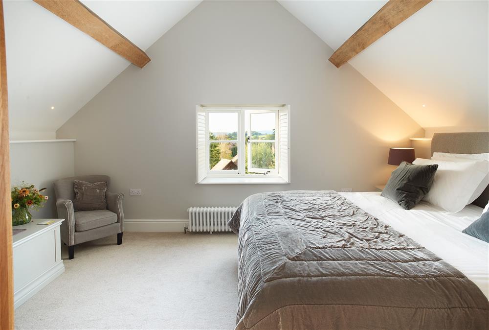 First floor: Spacious bedroom with lovely rural views at Unconformity Barn, Hope Bowdler, near Church Stretton