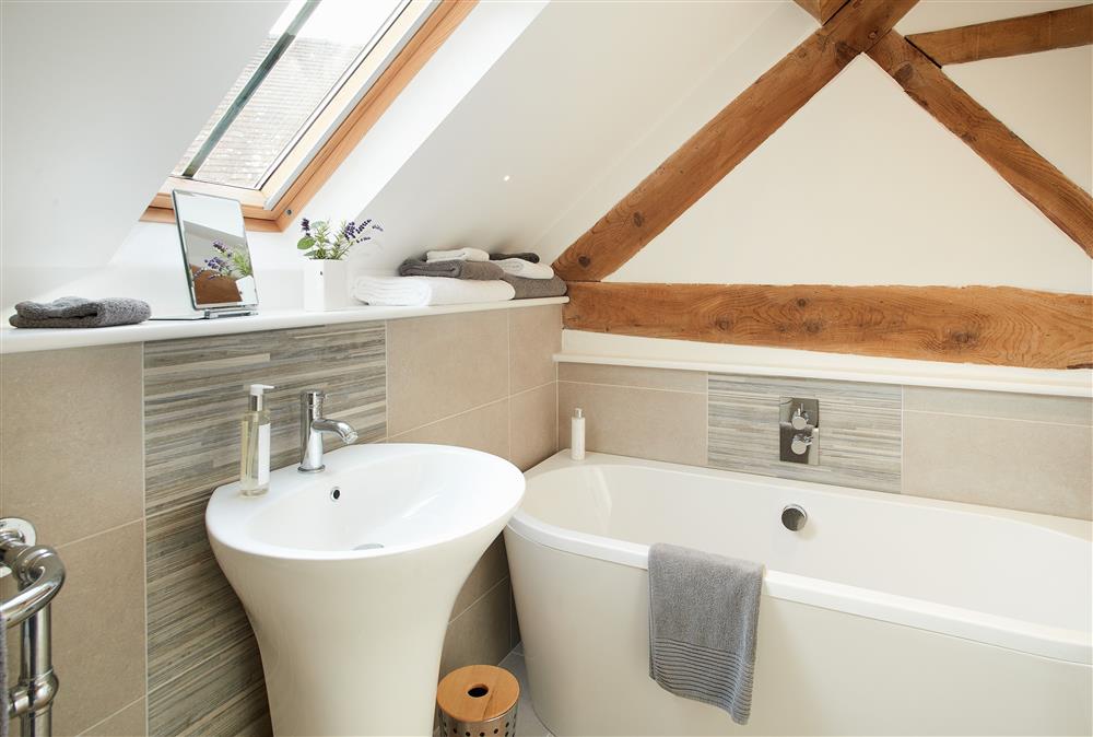 Unconformity Barn, Shropshire: Bathroom with feature free-standing bath and separate walk-in shower at Unconformity Barn, Hope Bowdler, near Church Stretton