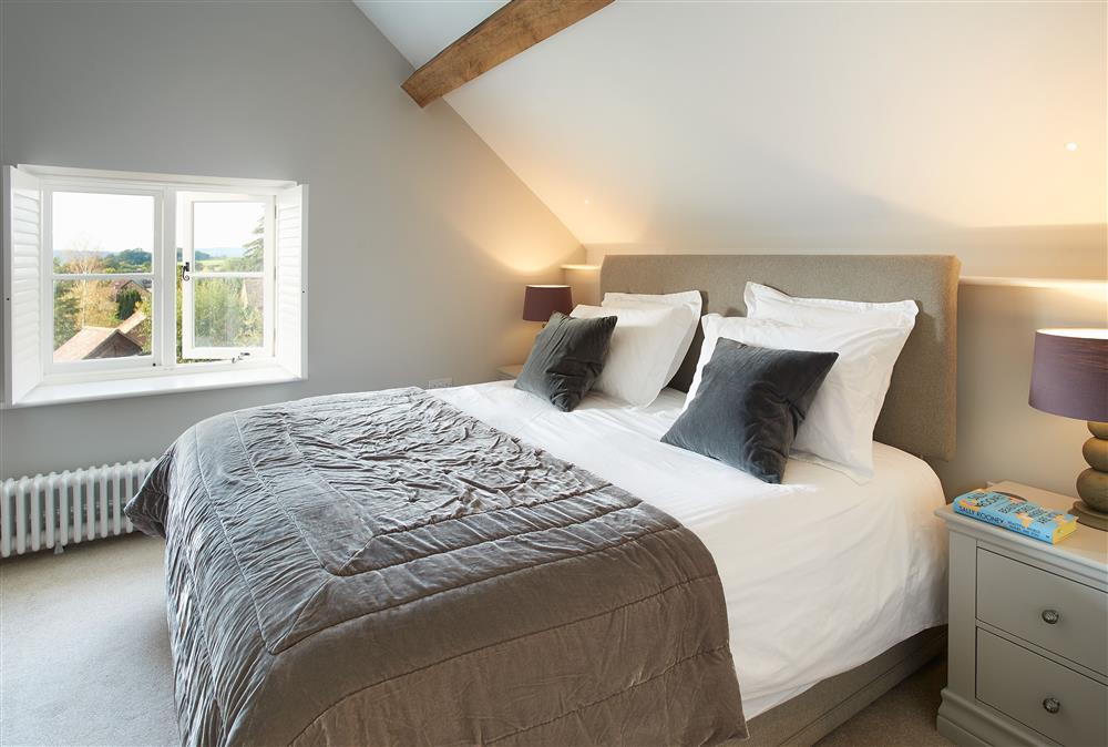 Unconformity Barn, Shropshire: Bedroom with a 6ft super-king size bed and rural countryside view at Unconformity Barn, Hope Bowdler, near Church Stretton