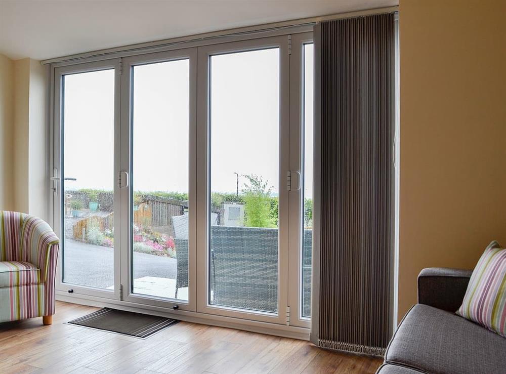 Bring the outside in with the living room’s bi-fold doors at The Outlook, 