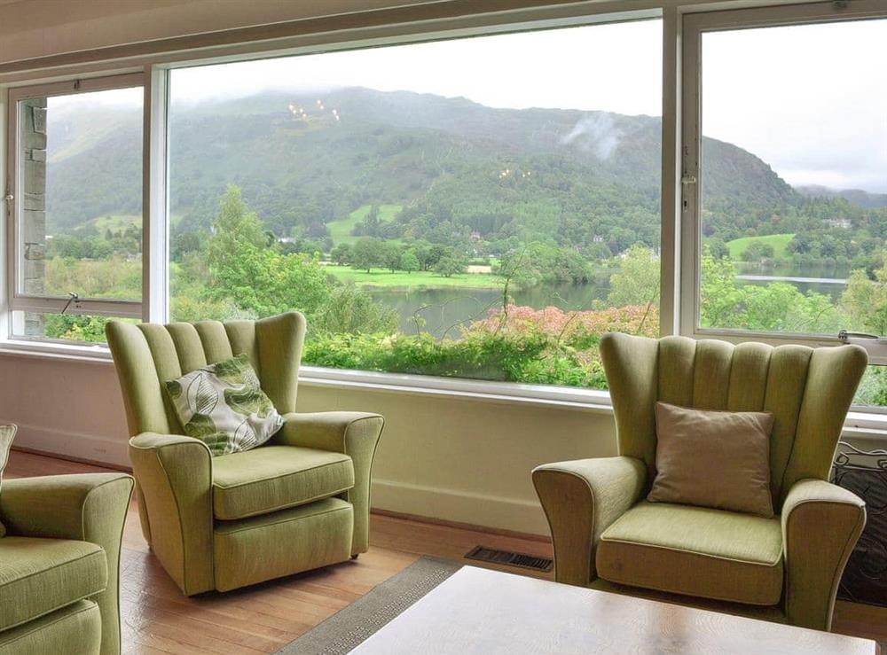 Lounge with a large picture window overlooking the lake and fells at Unerigg in Grasmere, Cumbria