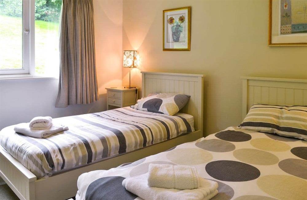 Tranquil bedroom with twin beds at Unerigg in Grasmere, Cumbria