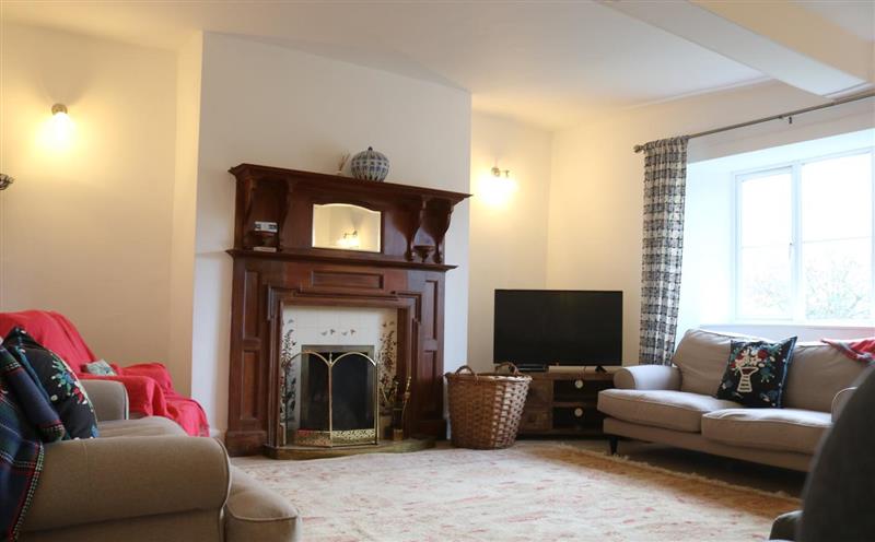 Enjoy the living room at Upcott Farm House, Winsford