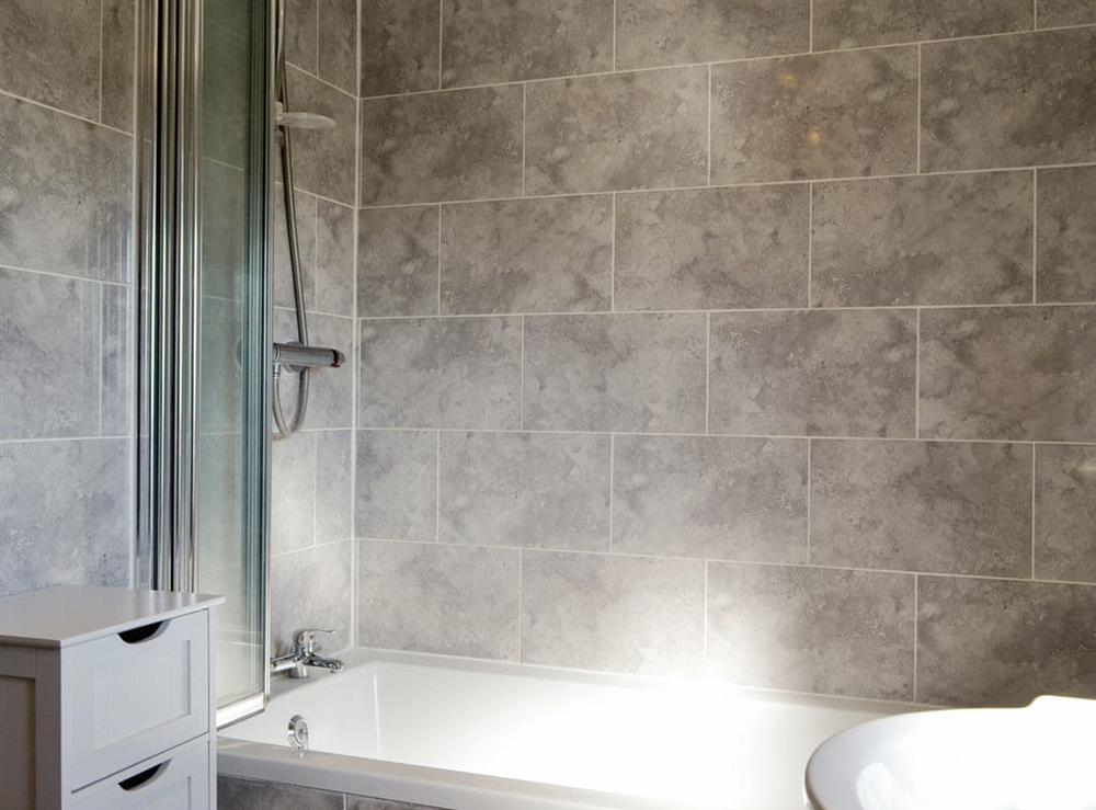 Family bathroom with shower over bath at Upper Close in Walton, near Presteigne, Powys