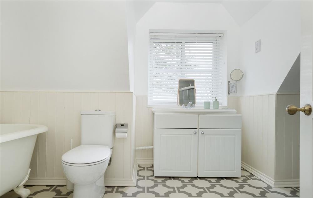 Family bathroom with roll top bath and shower at Upper End House, Shipton-under-Wychwood