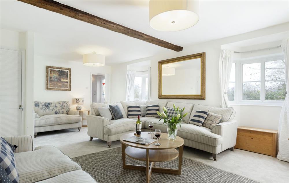 Space for the whole family to relax together in the sitting room at Upper End House, Shipton-under-Wychwood