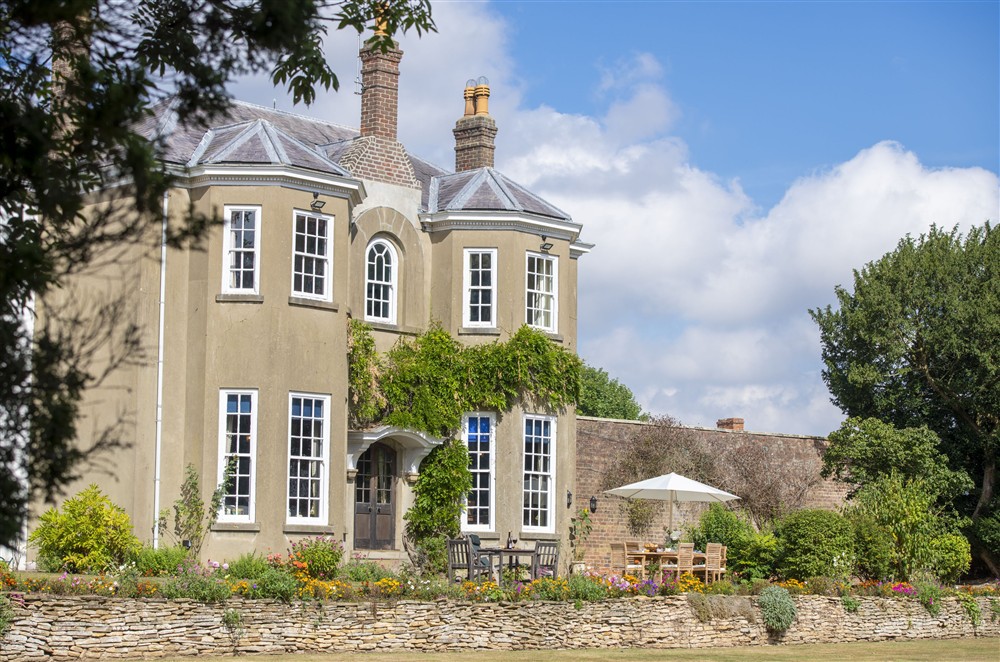 A handsome blend of Georgian and Victorian architecture, with tennis courts at Upper Helmsley Hall, York, North Yorkshire