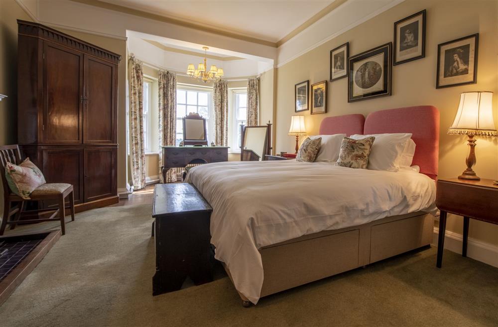 Bedroom one with a 6’ super-king size zip and link bed at Upper Helmsley Hall, York