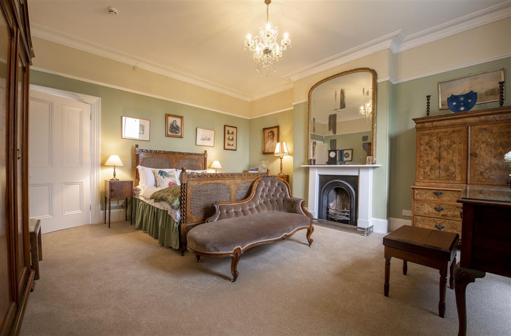 Bedroom three with a 4’6 double bed and open fire at Upper Helmsley Hall, York