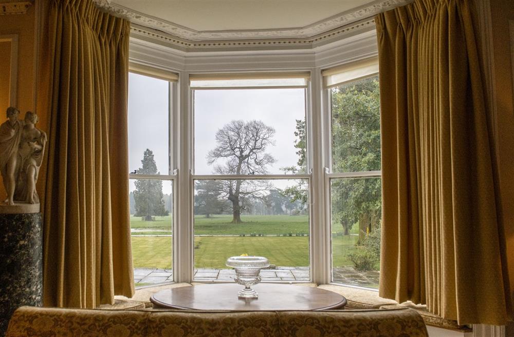 Drawing room with window seats overlooking the grounds at Upper Helmsley Hall, York