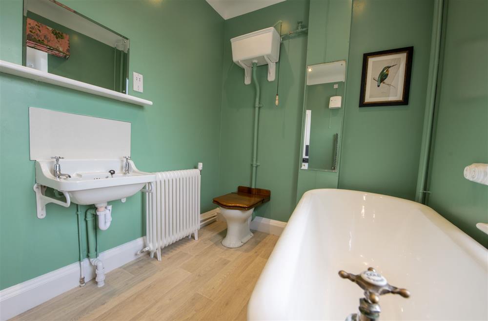 Family bathroom with free-standing, roll-top bath at Upper Helmsley Hall, York