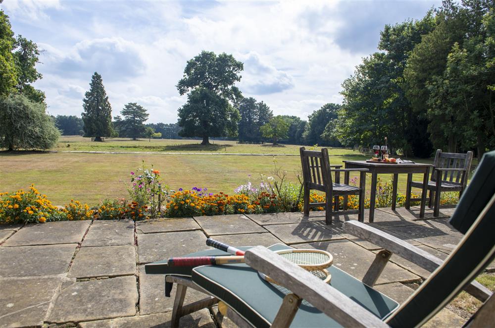 Terrace with recliners, looking out onto the garden views at Upper Helmsley Hall, York