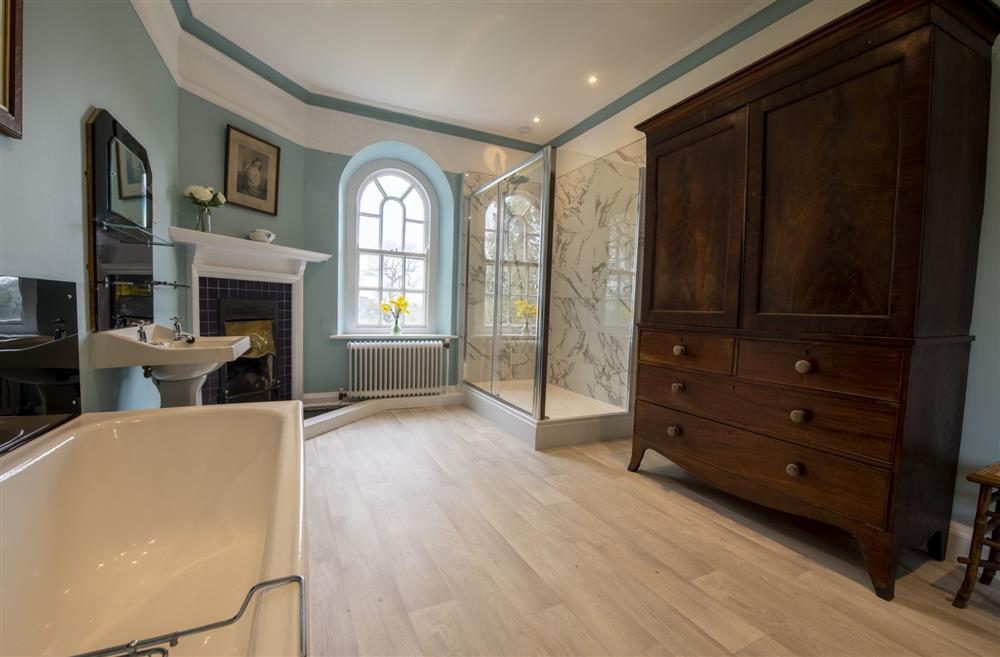West wing family bathroom with bath and separate walk-in shower at Upper Helmsley Hall, York