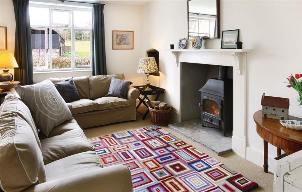 Second sitting room with wood burning stove at Upper Mowley, Titley