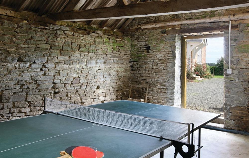 Table tennis in outer building at Upper Mowley, Titley