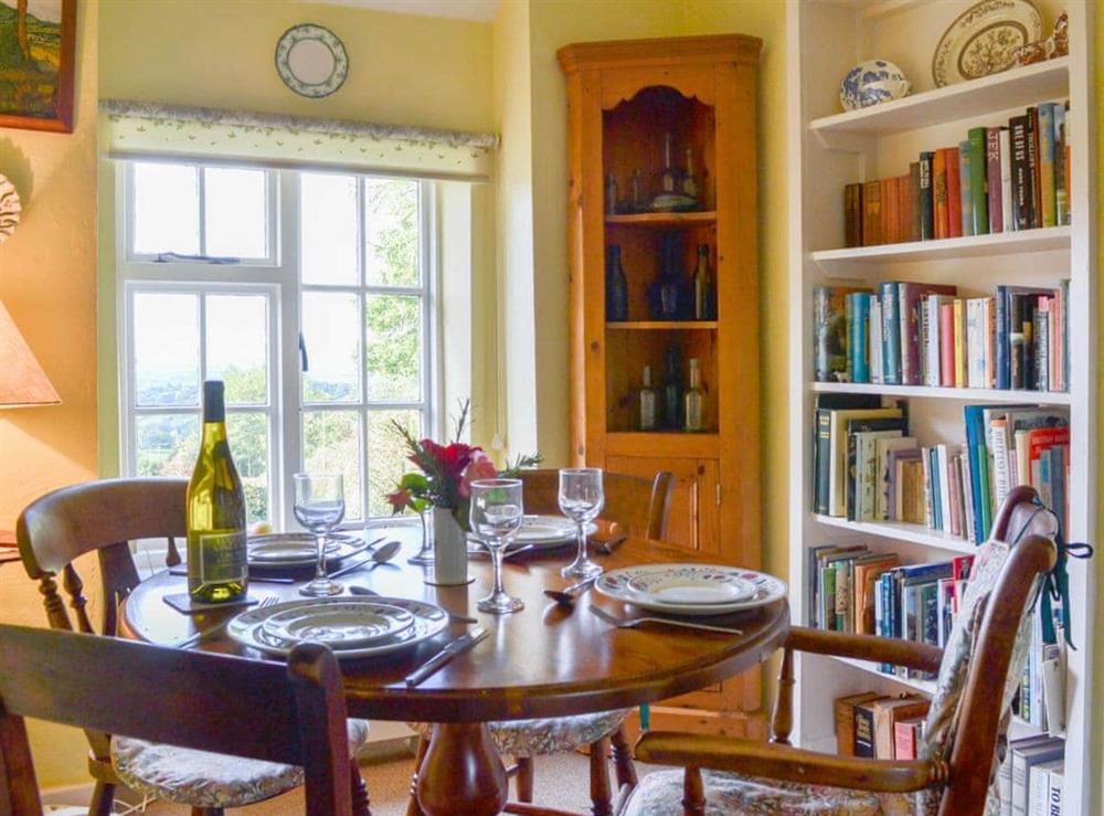 Modest yet light and airy dining room at Upper Stanbatch Cottage in Wentnor, near Bishops Castle, Shropshire