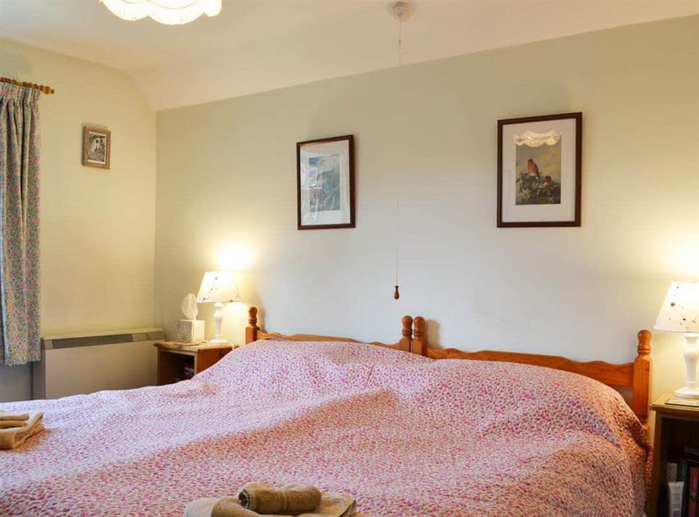 Twin bedded room at Upper Stanbatch Cottage in Wentnor, near Bishops Castle, Shropshire
