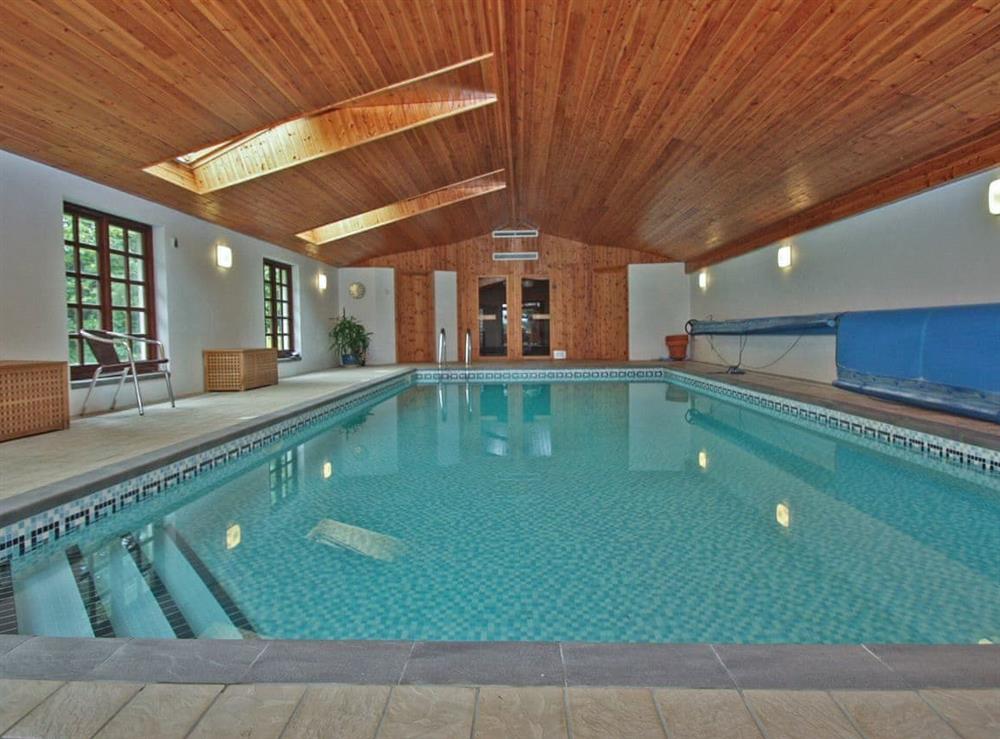On-site shared swimming pool at Cothi Cottage, 