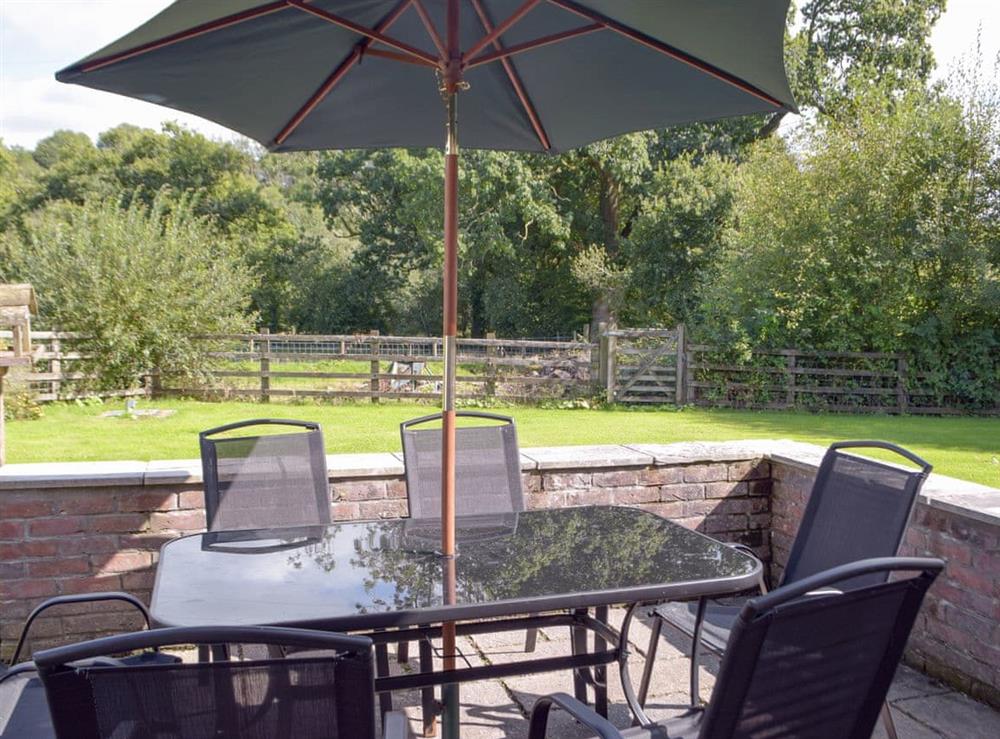 Paved patio area with outdoor furniture at Cothi Cottage, 