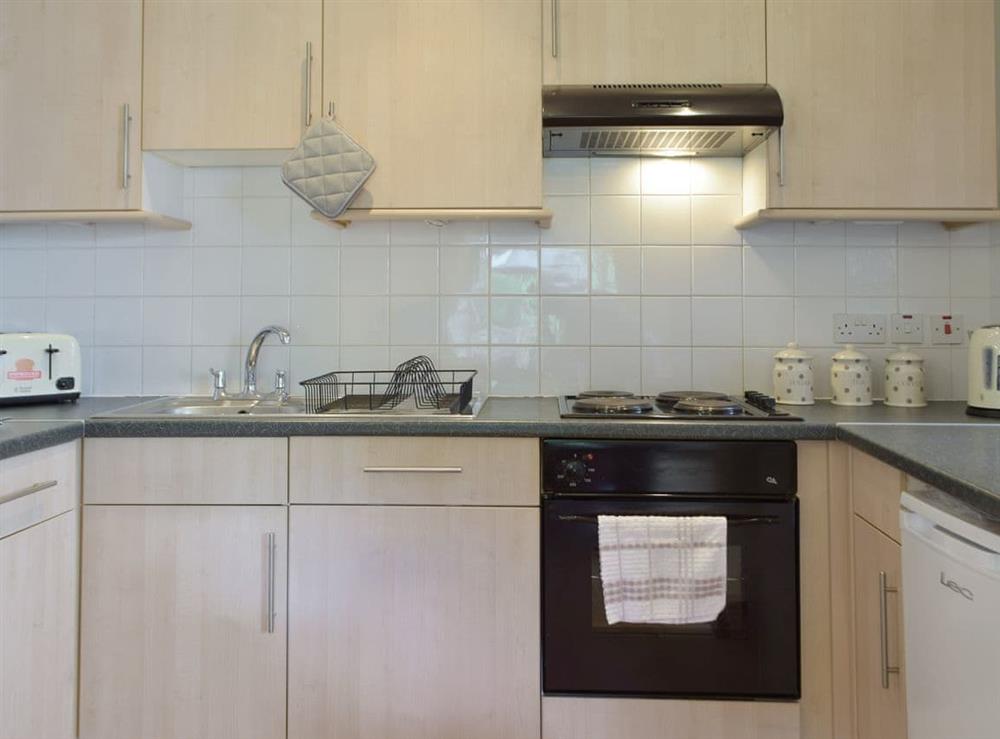 Well-equipped fitted kitchen at Cothi Cottage, 