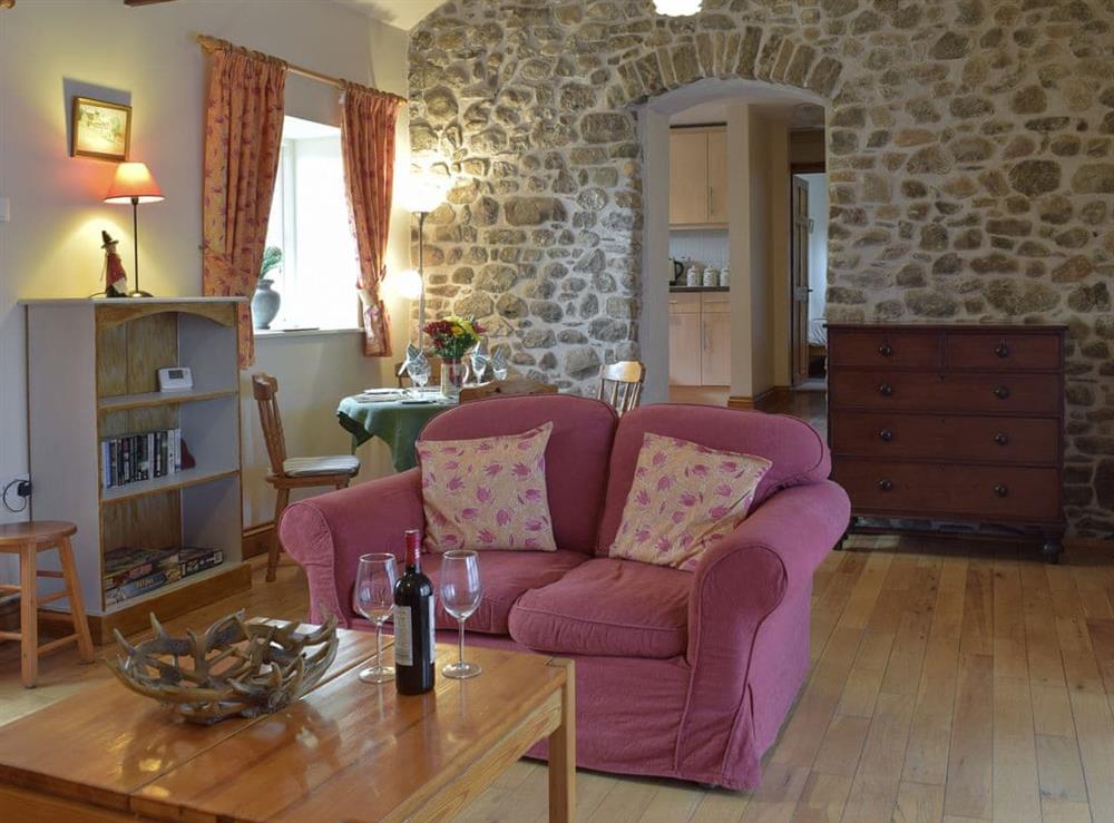 Living room and dining area at Gwili Cottage, 