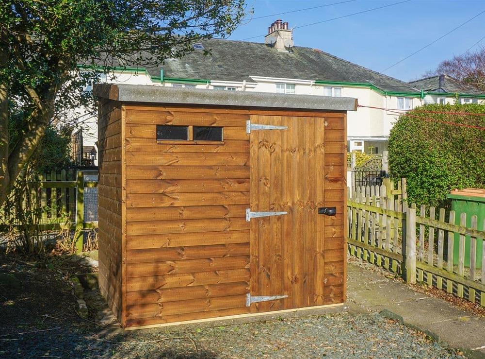 Rear garden with lockable shed for cycles and outdoor equipment at Valentine Cottage  in Keswick, Cumbria