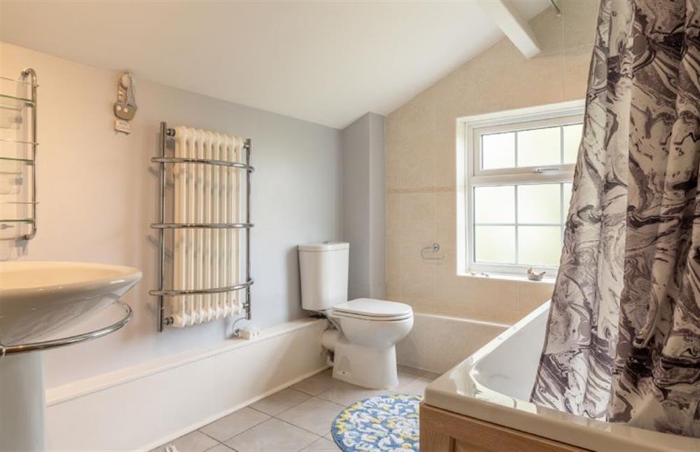 Bathroom with bath and shower over, wash basin and WC at Valentine Cottage, Snape Watering