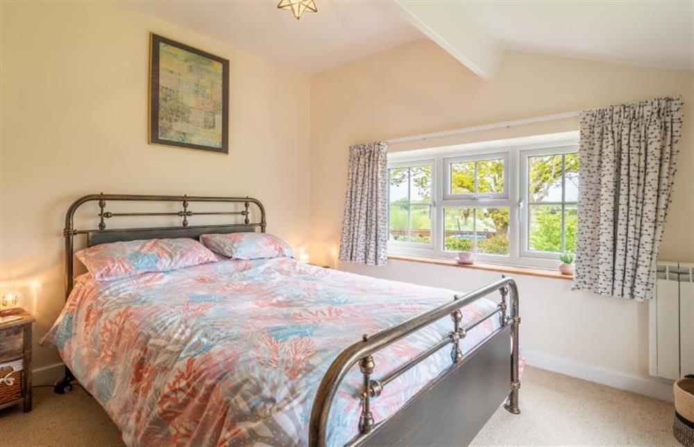 Master bedroom with double bed at Valentine Cottage, Snape Watering