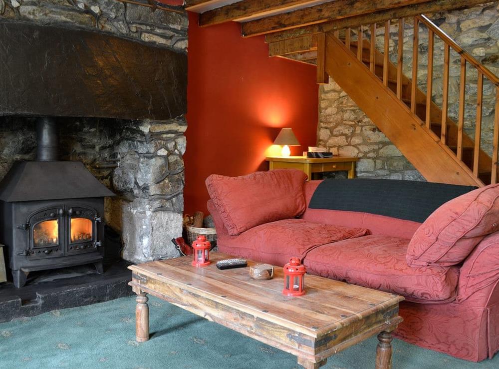 Living room with wood burner at Valley Cottage in Cwm Penmachno, near Betws-y-Coed, Conwy, Gwynedd