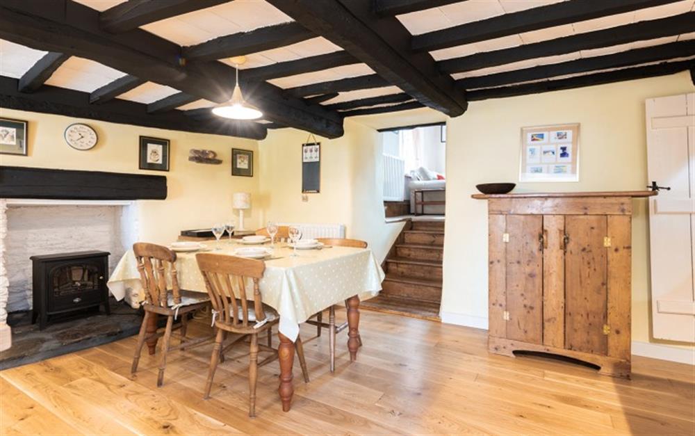 the dining area in this traditional cottage at Valley Cottage in Slapton
