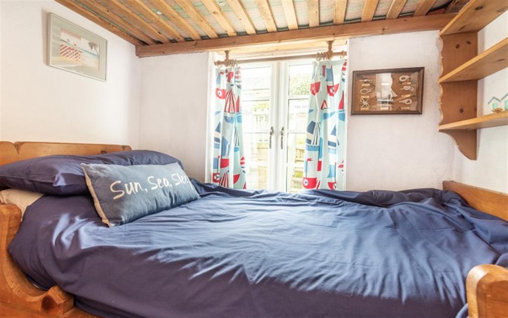 The single bedroom with built in bed at Valley Cottage in Slapton
