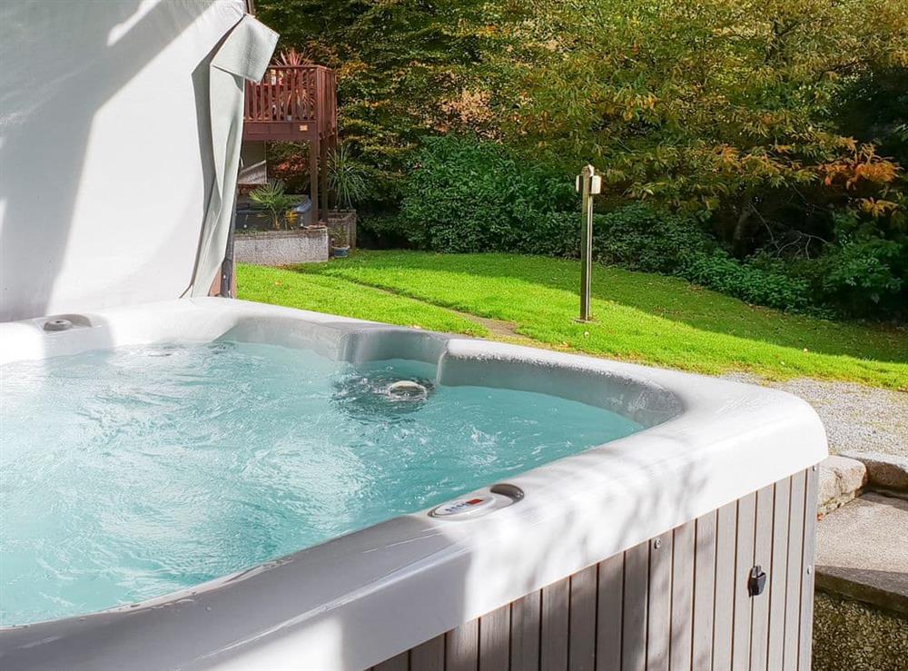 Private hot tub on the decked balcony at Valley Lodge 47 in Gunnislake, near Callington, Cornwall